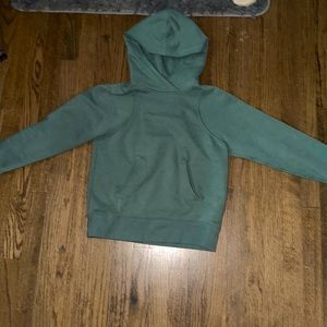 A Lululemon Loungeful Hoodie. Size 2, lightly worn in Tidal teal.